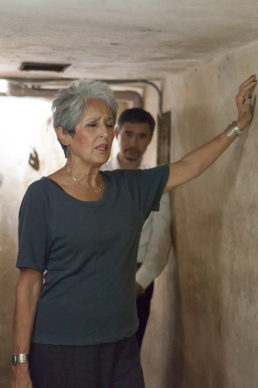 Joan Baez - a moving moment of silence - at the Metropole air raid shelter, where she had spent so many fearful moments.